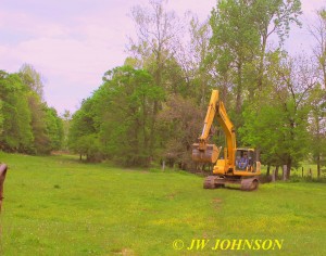 19 Danny Drives Trackhoe Across Field