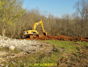 23 Trackhoe Fills In Trench on Hill