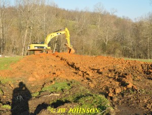 24 Trackhoe Fills In Trench on Hill