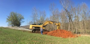 Digging Up Side of Hill in Pasture Near Columbia Mine